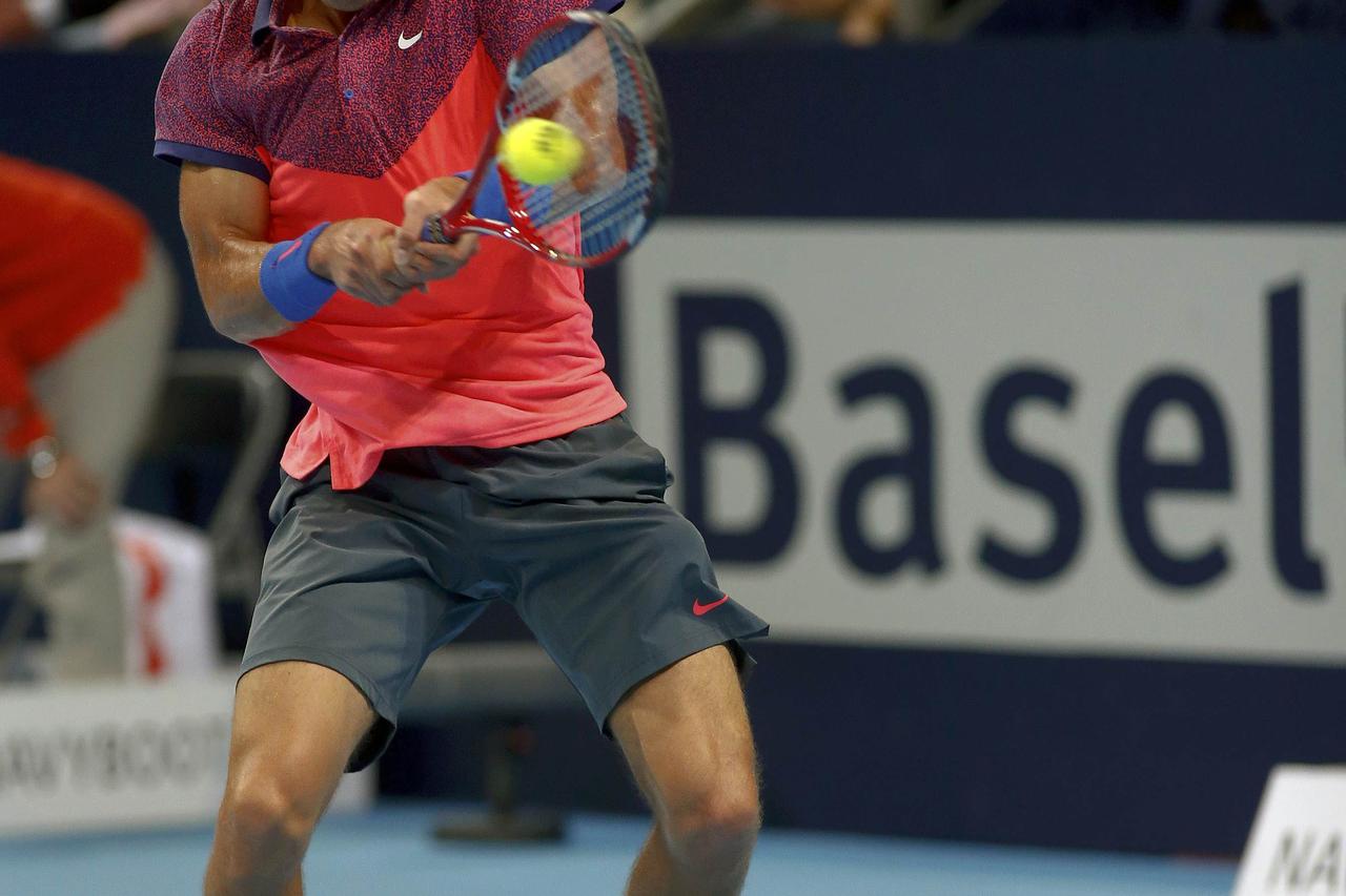 Borna Coric of Croatia returns the ball to Belgium's David Goffin during their semi-final match at the Swiss Indoors ATP tennis tournament in Basel October 24, 2014.  REUTERS/Arnd Wiegmann (SWITZERLAND - Tags: SPORT TENNIS)