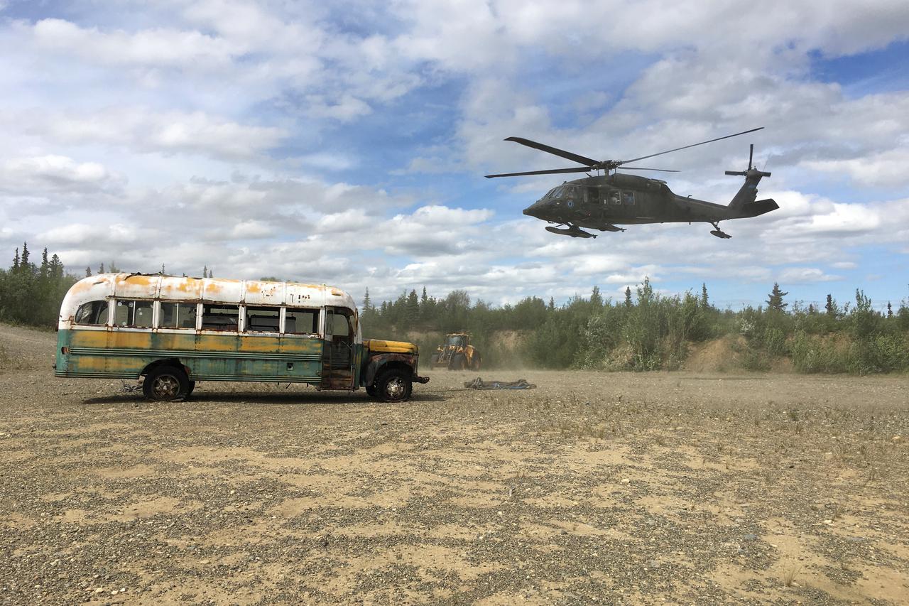 Alaska Army National Guard helicopter hovers near "Bus 142" near Stampede Road