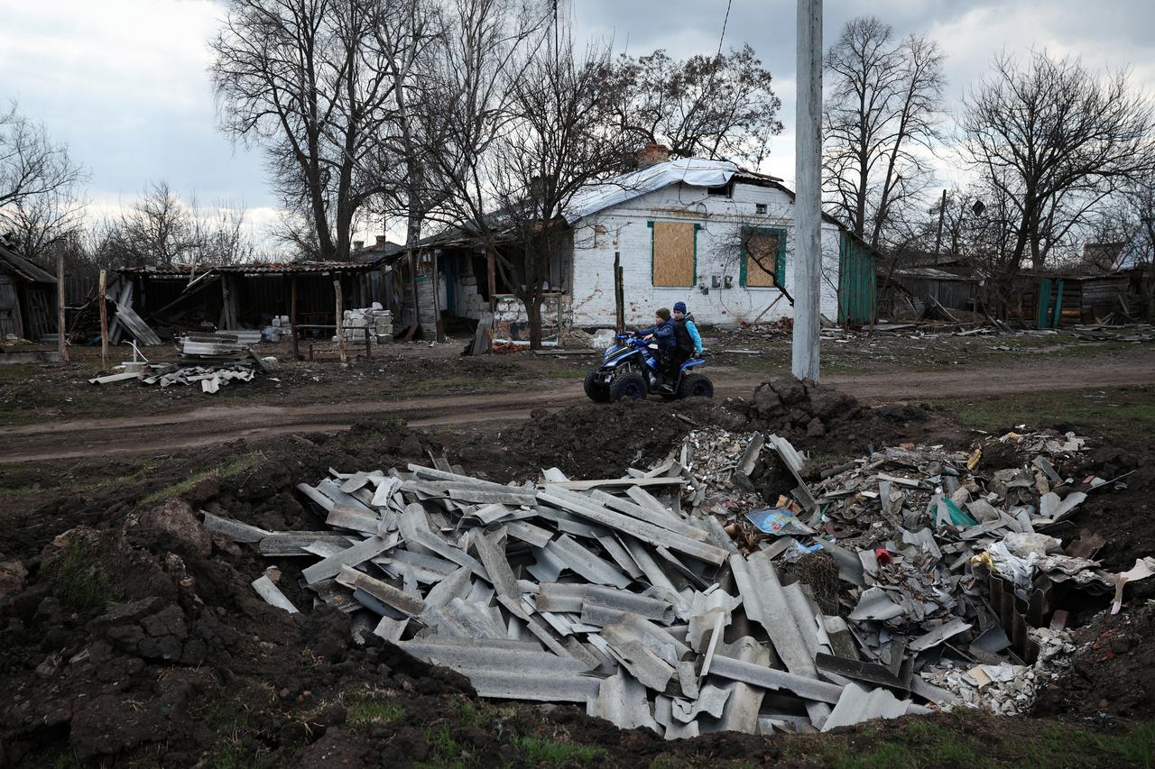 The Wider Image: Childhood shaped by war for two Ukrainian brothers