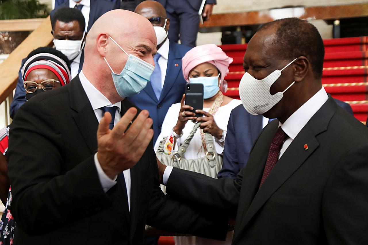 FIFA president Gianni Infantino speaks to Ivory Coast's President Alassane Ouattara at the presidential palace, in Abidjan