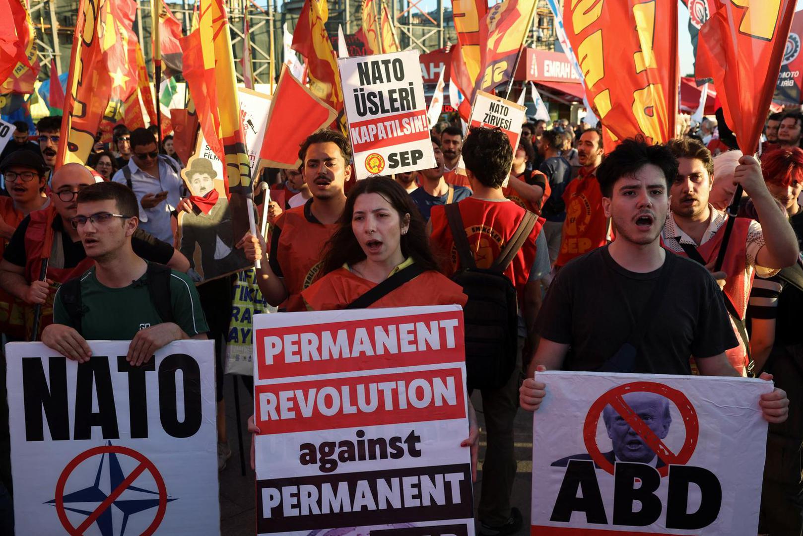 Demonstrators hold signs and flags during a protest ahead of NATO leaders' summit, in Istanbul, Turkey, July 5, 2026. REUTERS/Dilara Senkaya Photo: DILARA SENKAYA/REUTERS