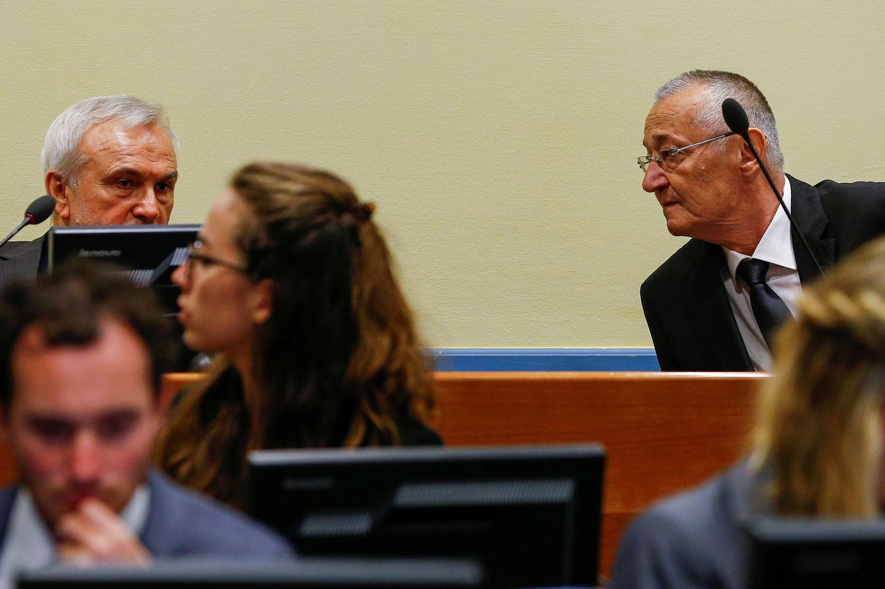 FILE PHOTO: Jovica Stanisic (L) and Franko Simatovic appear in court for their re-trial at the United Nations tribunal for the former Yugoslavia in The Hague