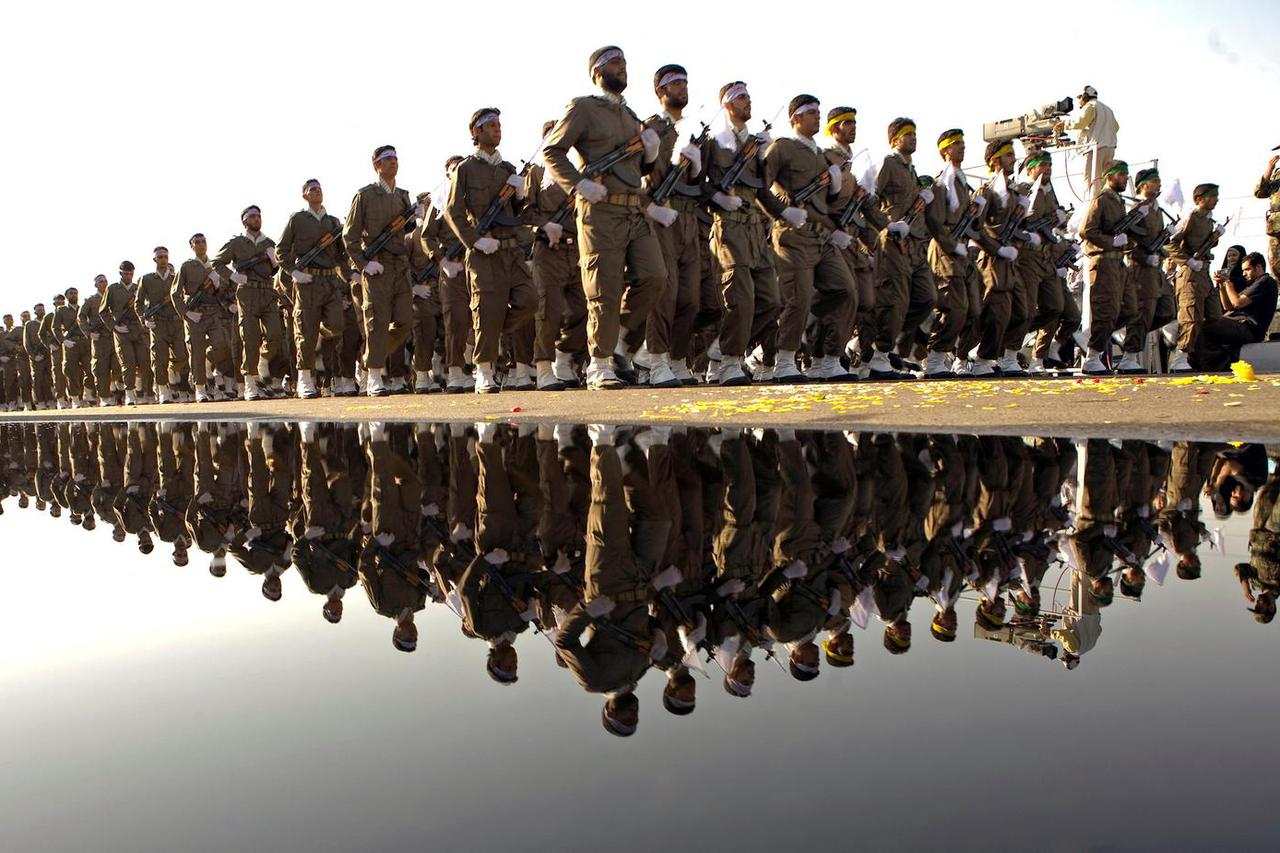 FILE PHOTO: Members of Iran's Revolutionary Guards take part in a military parade to commemorate the 1980-88 Iran-Iraq war in Tehran