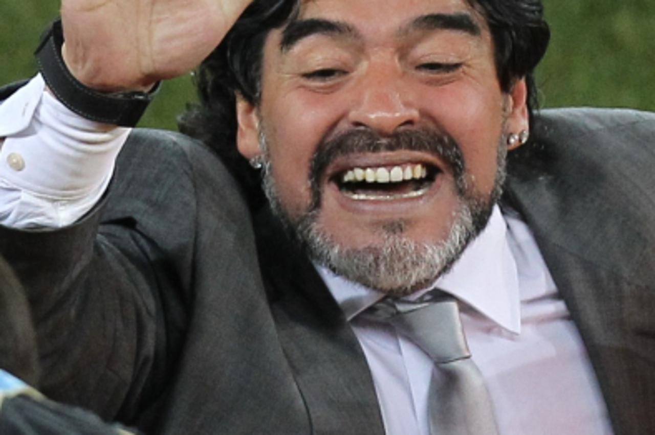 'Argentina\'s coach Diego Maradona celebrates after  striker Martin Palermo (not pictured) scored during the Group B first round 2010 World Cup football match Greece vs Argentina on June 22, 2010 at P