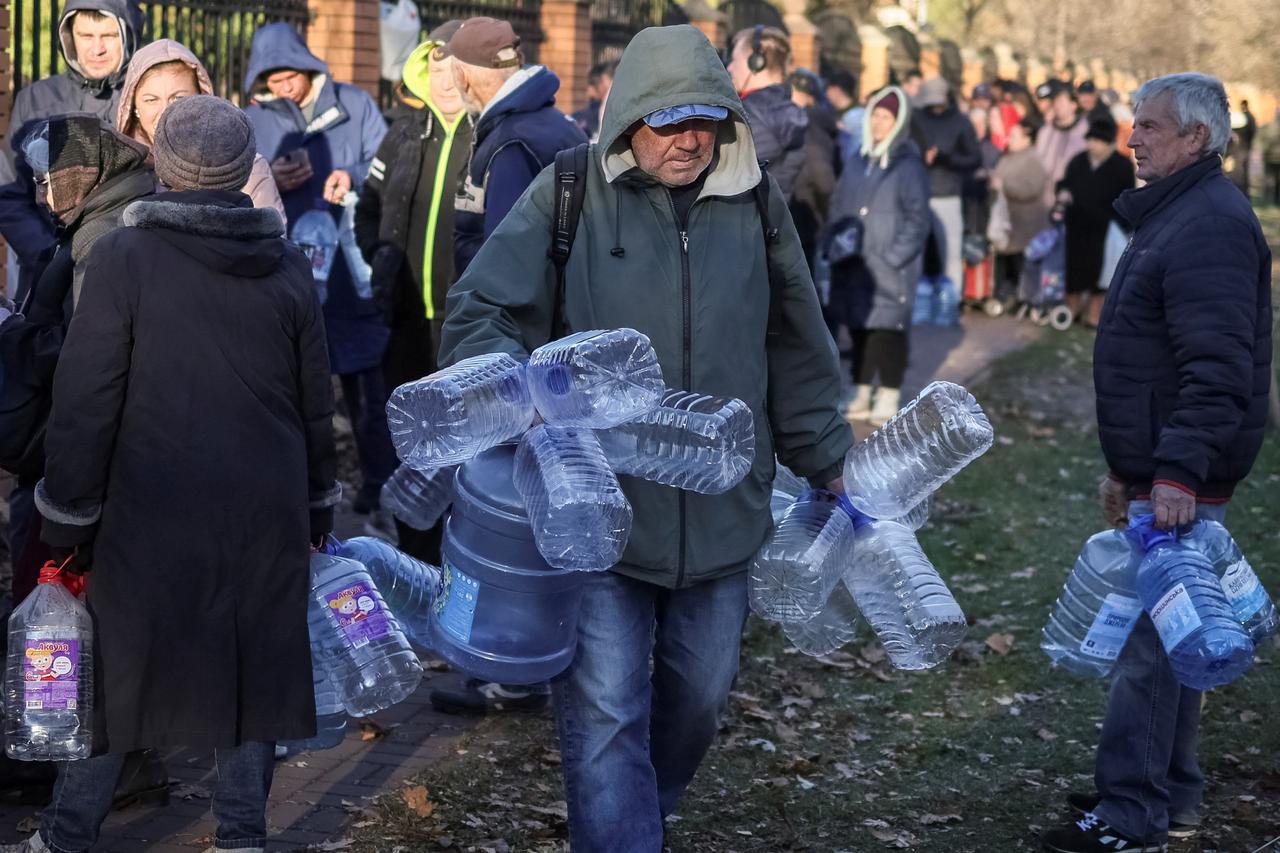 Local residents queue for water after a Russian missile attack in Kyiv