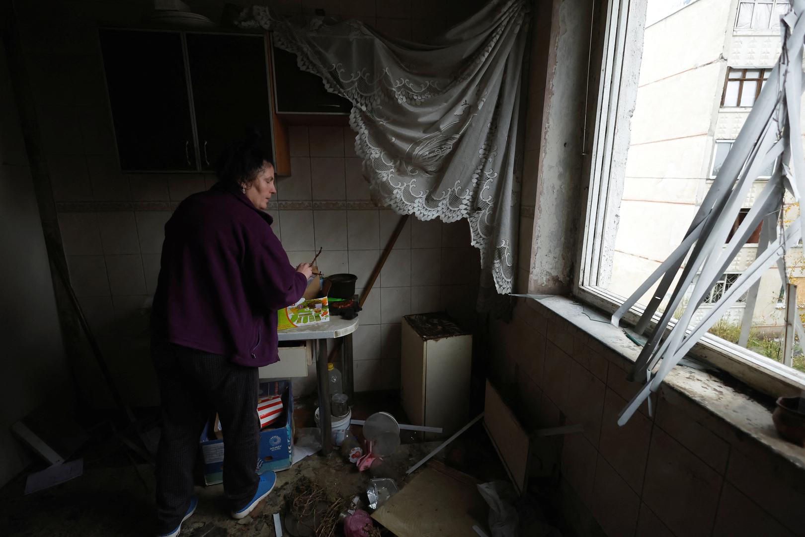 Svetlana waits in her apartment as she and her husband Vitali have called the police to report that somebody stole most of their possessions from their apartment, which was heavily damaged and rendered uninhabitable during Russian strikes, amid Russia's attack on Ukraine, in the North Saltivka area of Kharkiv, Ukraine, October 23, 2022. REUTERS/Clodagh Kilcoyne Photo: Clodagh Kilcoyne/REUTERS