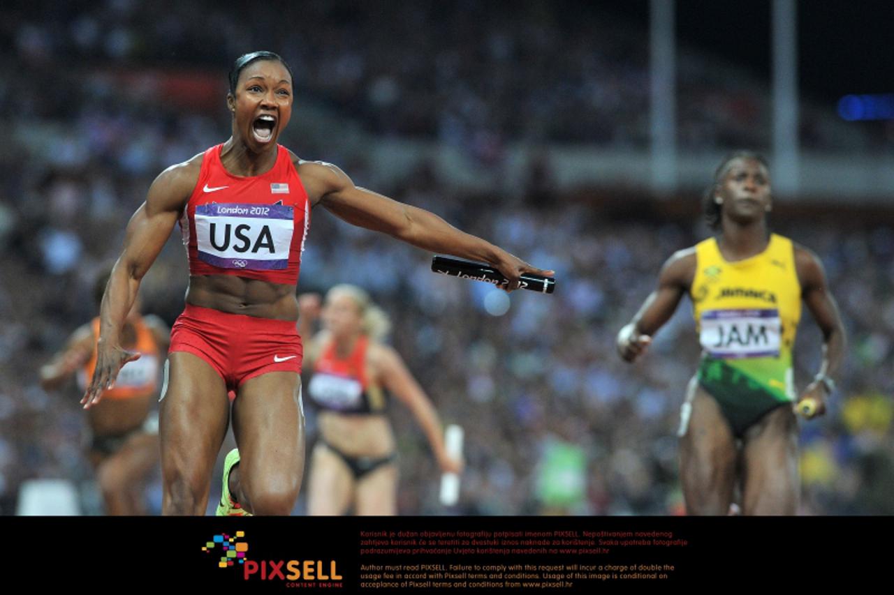 'USA\'s Carmelita Jeter runs the final leg and celebrates winning gold and breaking the world record in the Women\'s 4 x 100m relay at the Olympic Stadium, London Photo: Press Association/Pixsell'