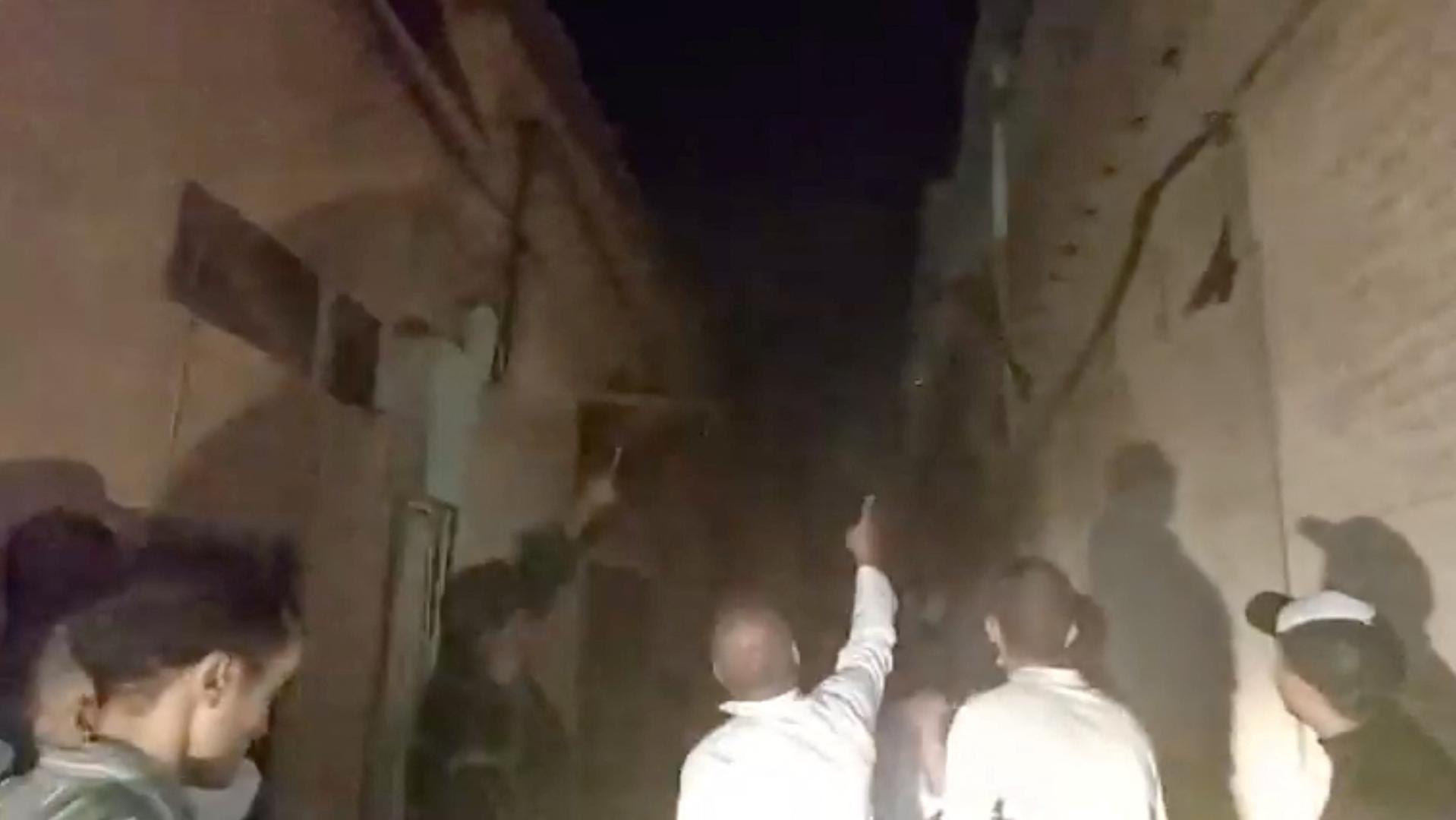 People look at the damage caused by an earthquake in Marrakech, Morocco September 9, 2023 in this screen grab from a social media video in this picture. Al Maghribi Al Youm/via REUTERS  THIS IMAGE HAS BEEN SUPPLIED BY A THIRD PARTY. MANDATORY CREDIT. NO RESALES. NO ARCHIVES. Photo: AL MAGHRIBI AL YOUM/REUTERS