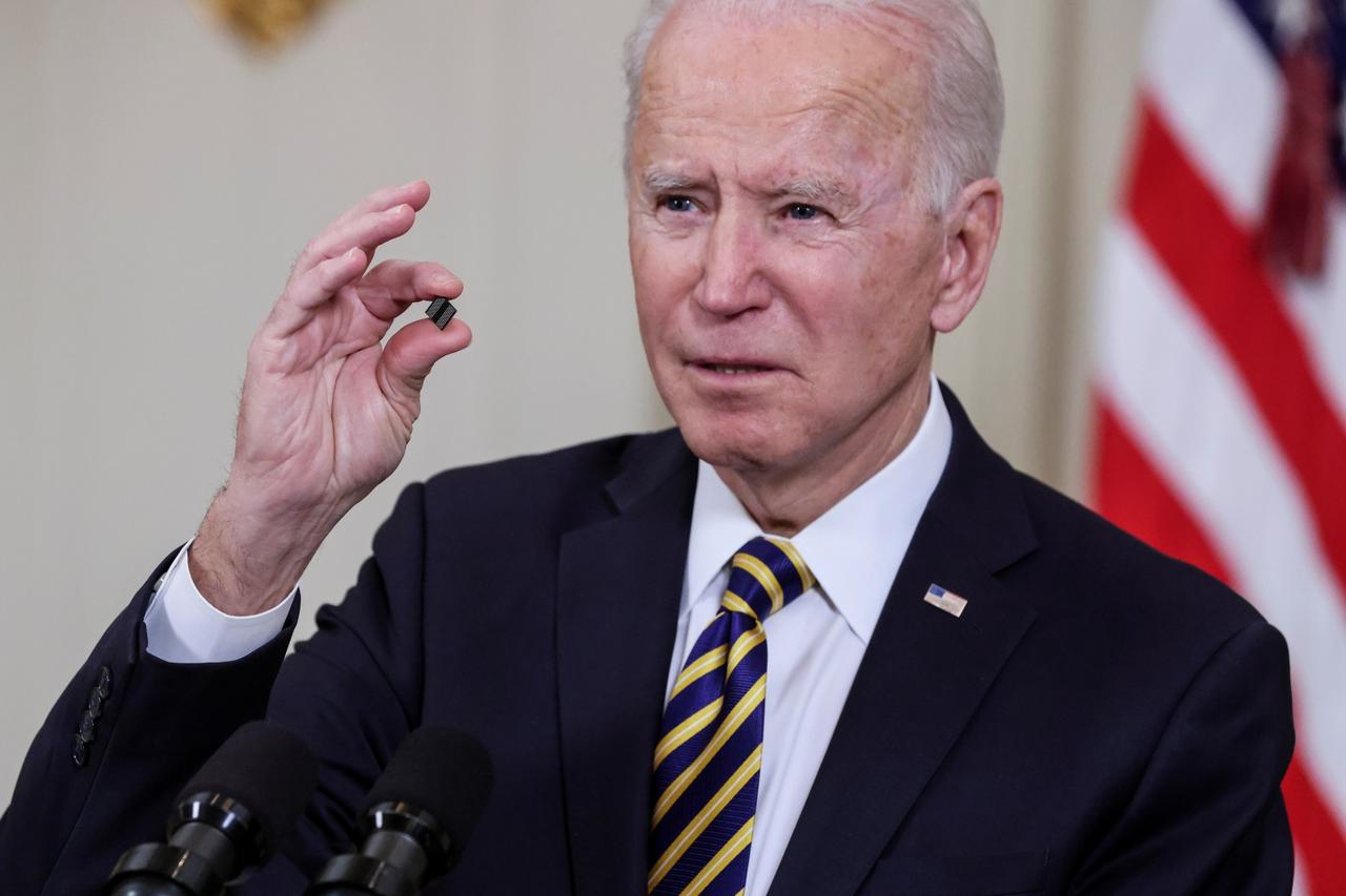 U.S. President Biden signs an executive order on the economy at the White House in Washington
