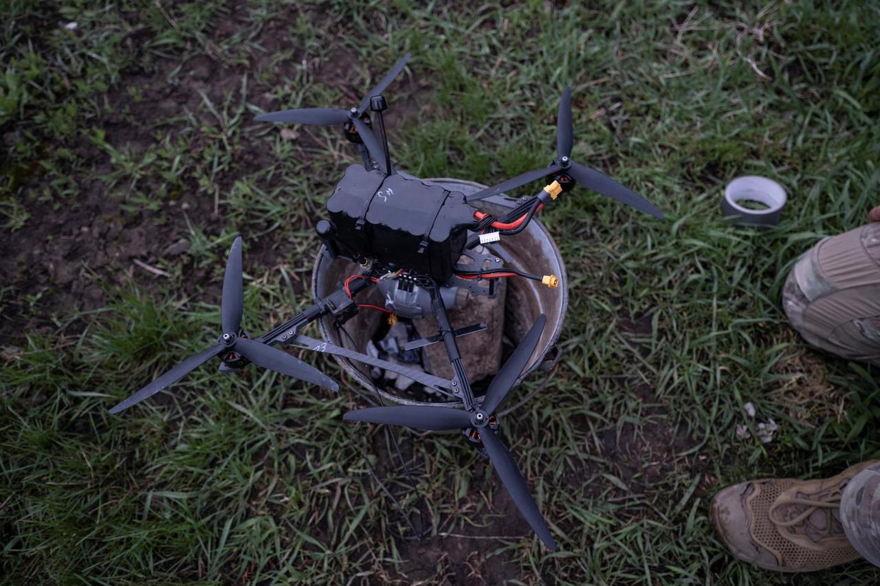 Ukrainian serviceman prepares an FPV-drone for a fly at a position on outskirts of a frontline town of Druzhkivka