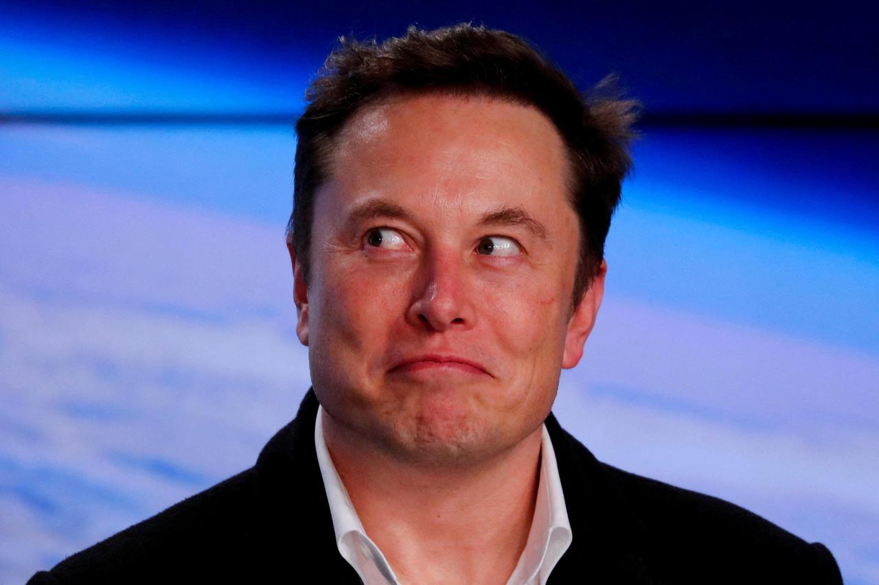 FILE PHOTO: FILE PHOTO: SpaceX founder Musk reacts at a post-launch news conference in Cape Canaveral