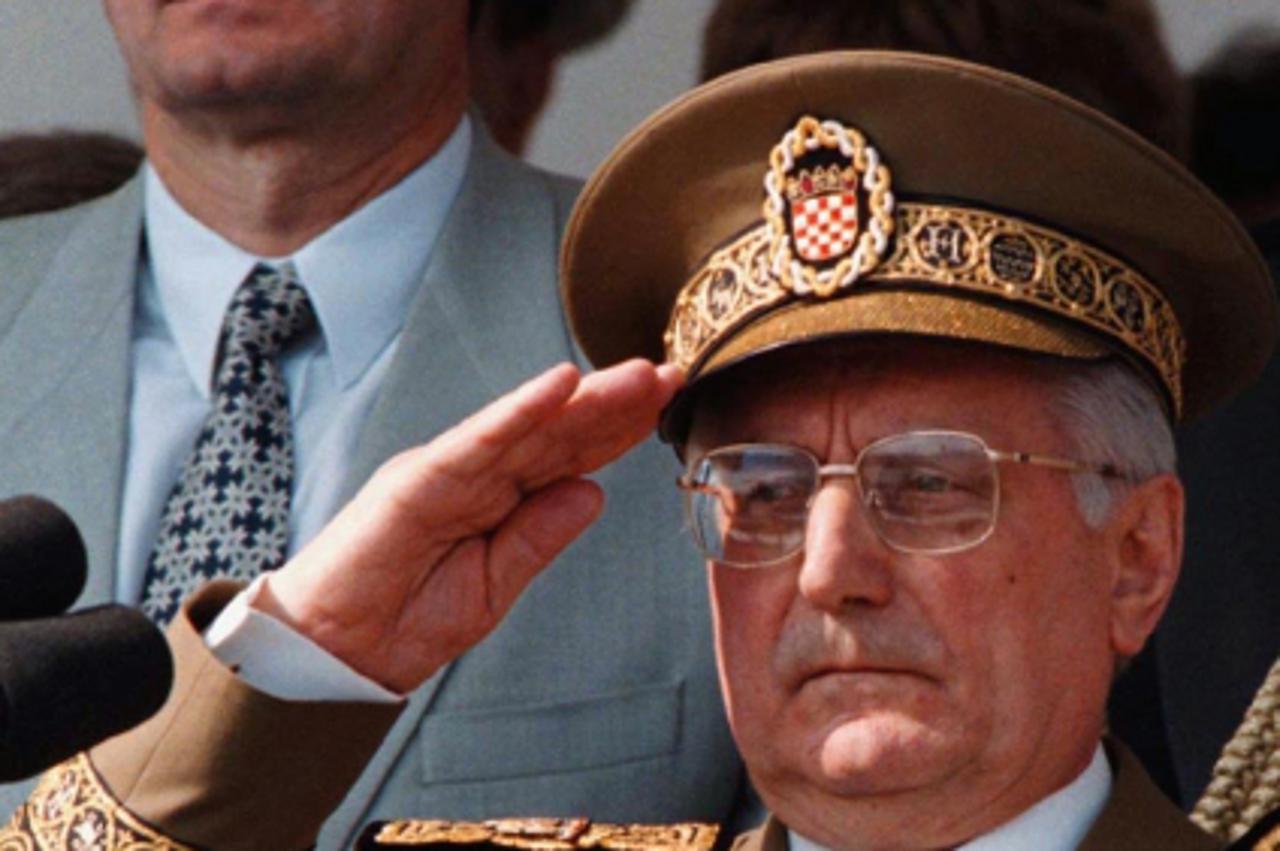'Croatia's late president Franjo Tudjman (R) salutes during a military parade, with his son and intelligence service chief, Miroslav, in the background in this 1997 file photo. Miroslav said on March