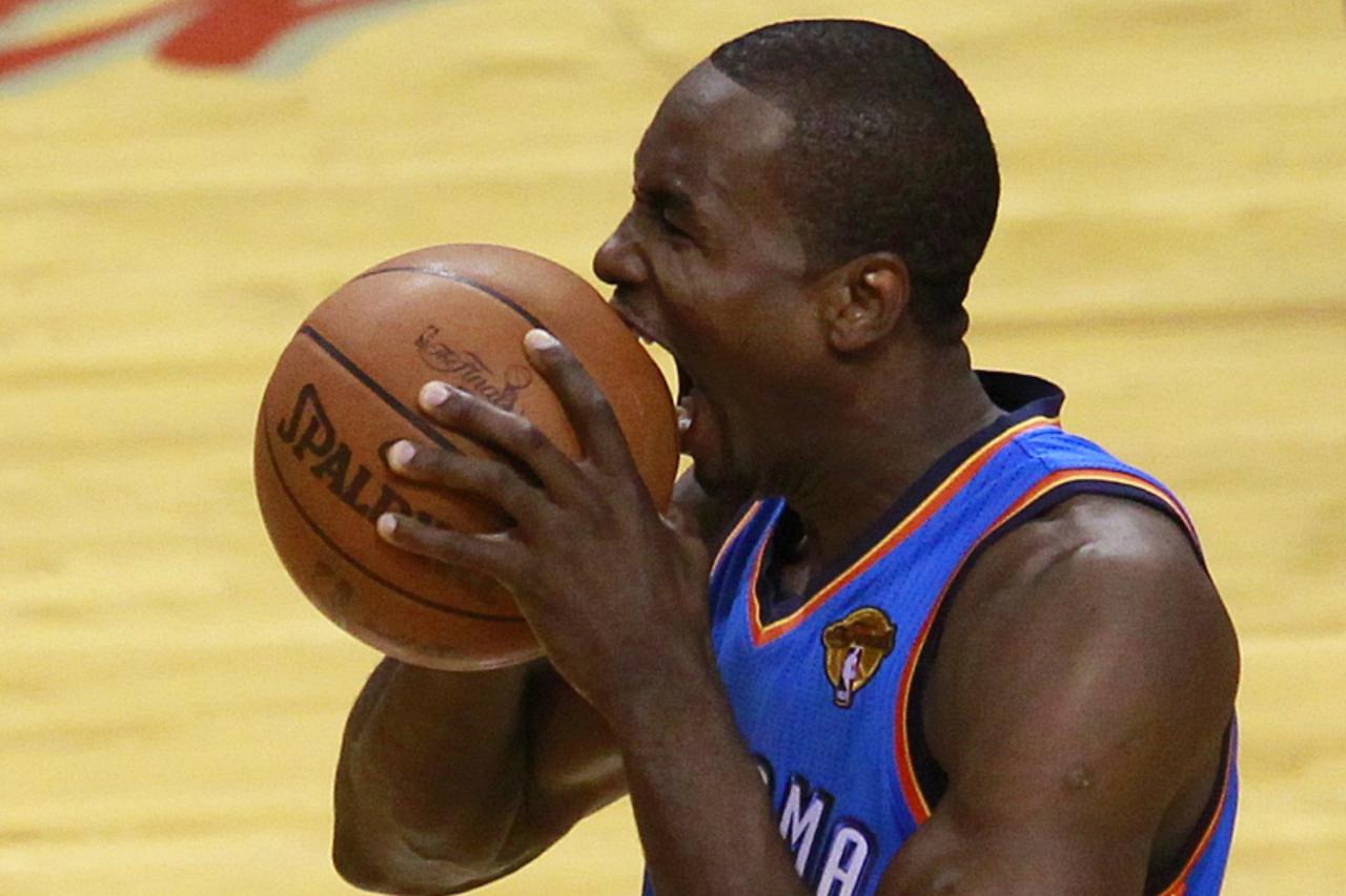 'Oklahoma City Thunder forward Serge Ibaka reacts to a time count violation against the Miami Heat in the first half during Game 3 of the NBA basketball finals in Miami, Florida June 17, 2012. REUTERS