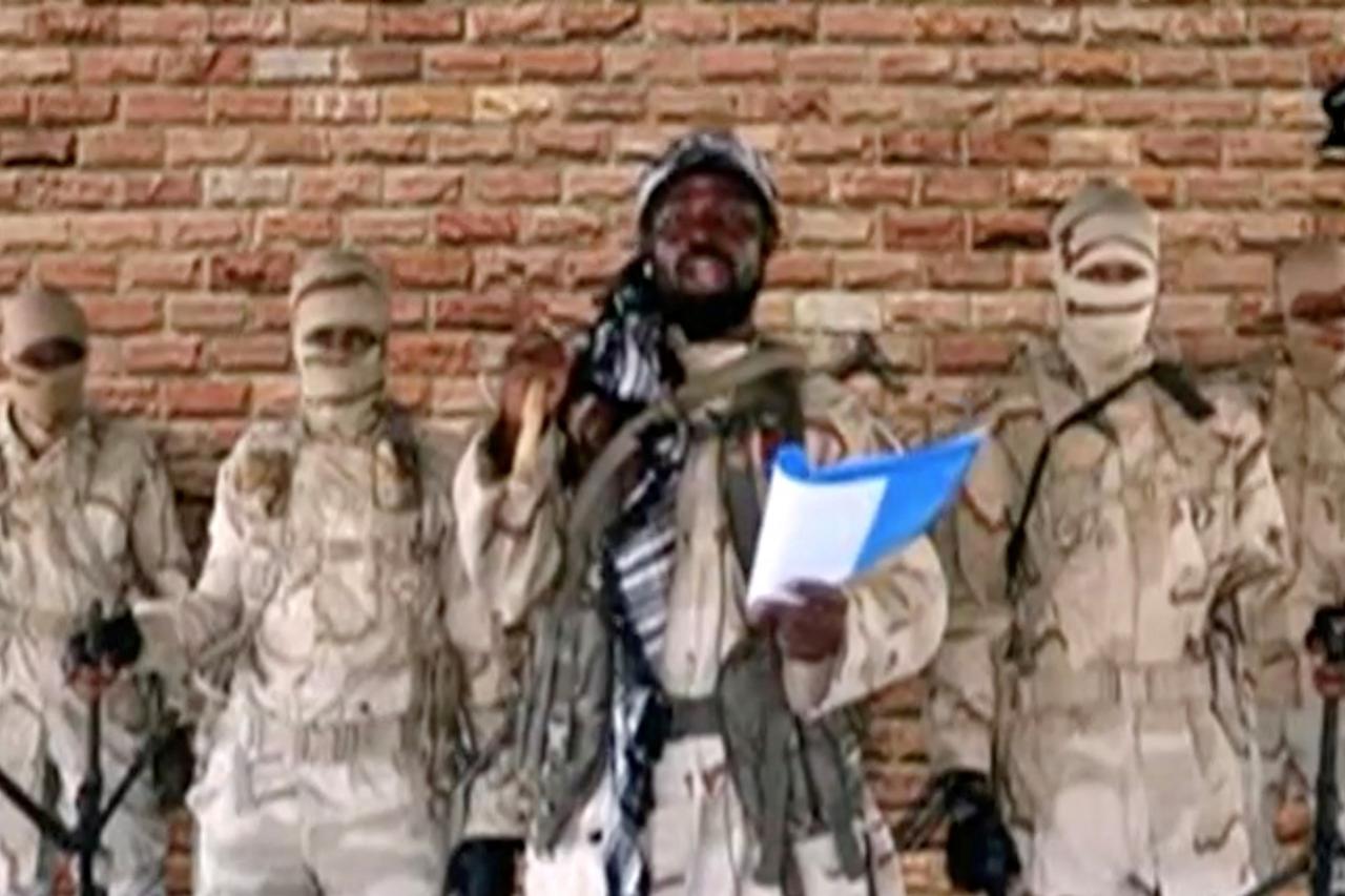 FILE PHOTO: Leader of one of the Boko Haram group's factions, Abubakar Shekau speaks in front of guards in an unknown location in Nigeria