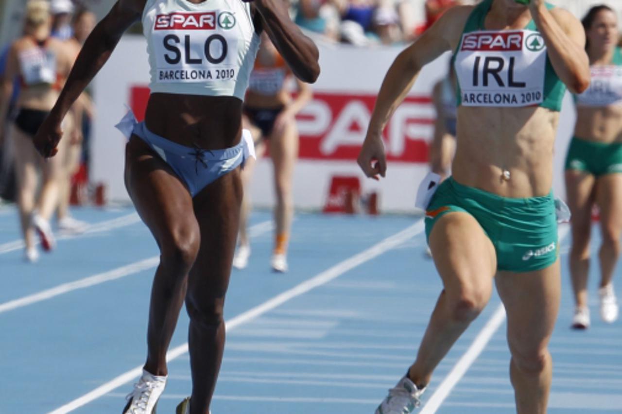 'Jamaican born Merlene Ottey, competing for Slovenia (L), runs next to Ireland\'s Ailis McSweeney during the women\'s 4 x 100 metres relay heats of the European Athletics Championships at the Olympic 