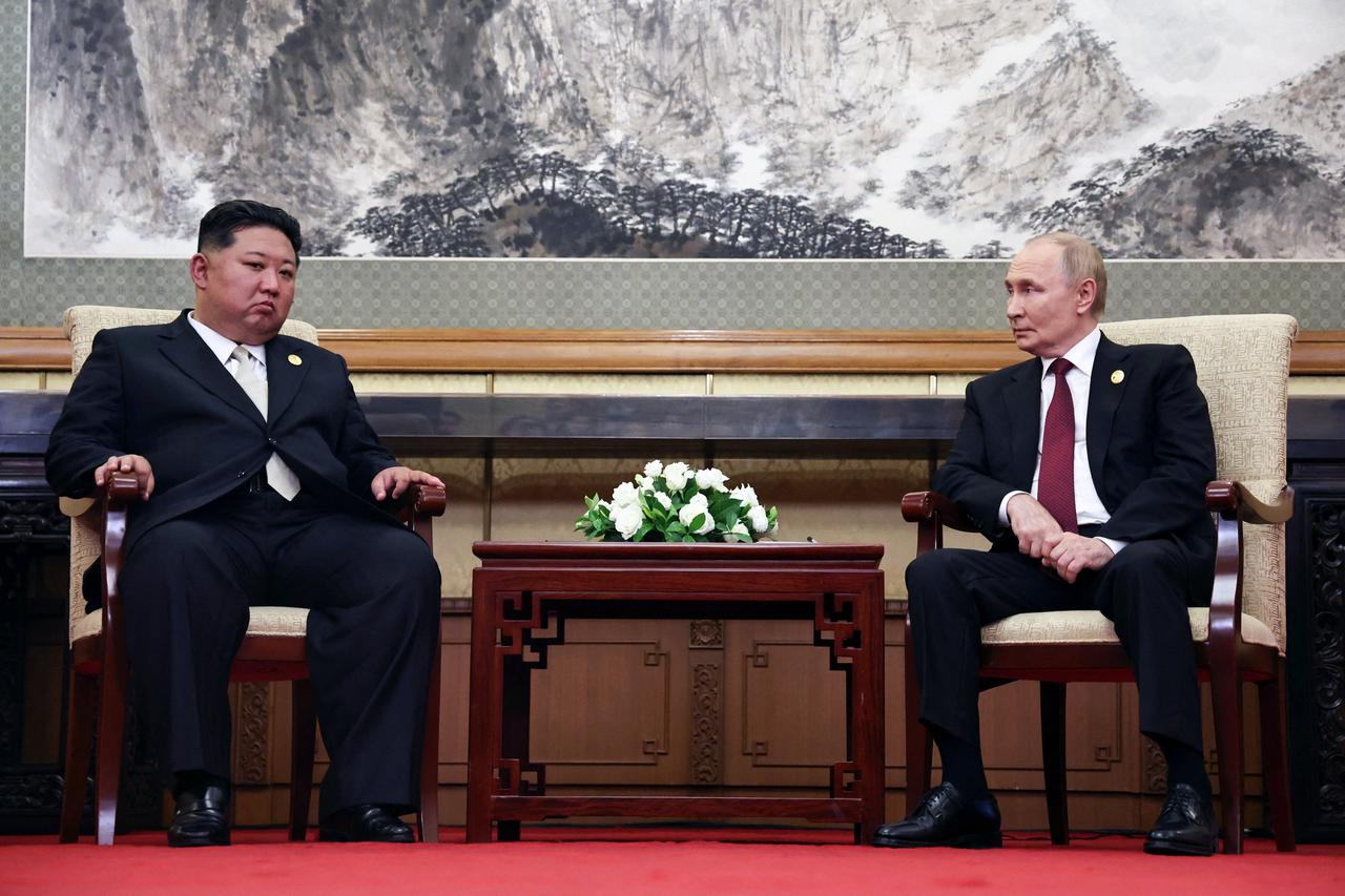 Russian President Vladimir Putin meets with North Korean leader Kim Jong Un in Beijing