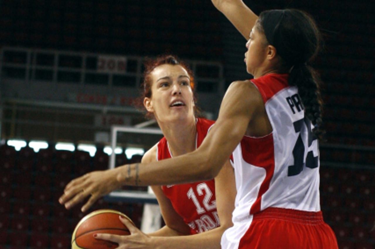 'Candace Parker (R) of Team USA challenges Iva Sliskovic of Team Croatia during their Olympic women\'s exhibition basketball game ahead of the London 2012 Olympic Games at the Abdi Ipekci Arena in Ist