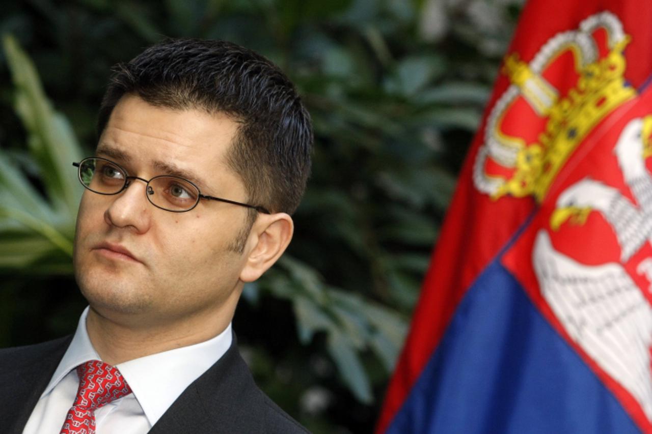 \'Serbian Foreign Minister Vuk Jeremic(L)  listens to his Hungarian counterpart Peter Balazs (out of camera range)  during a press conference after their meeting in the winter garden of the ministry a