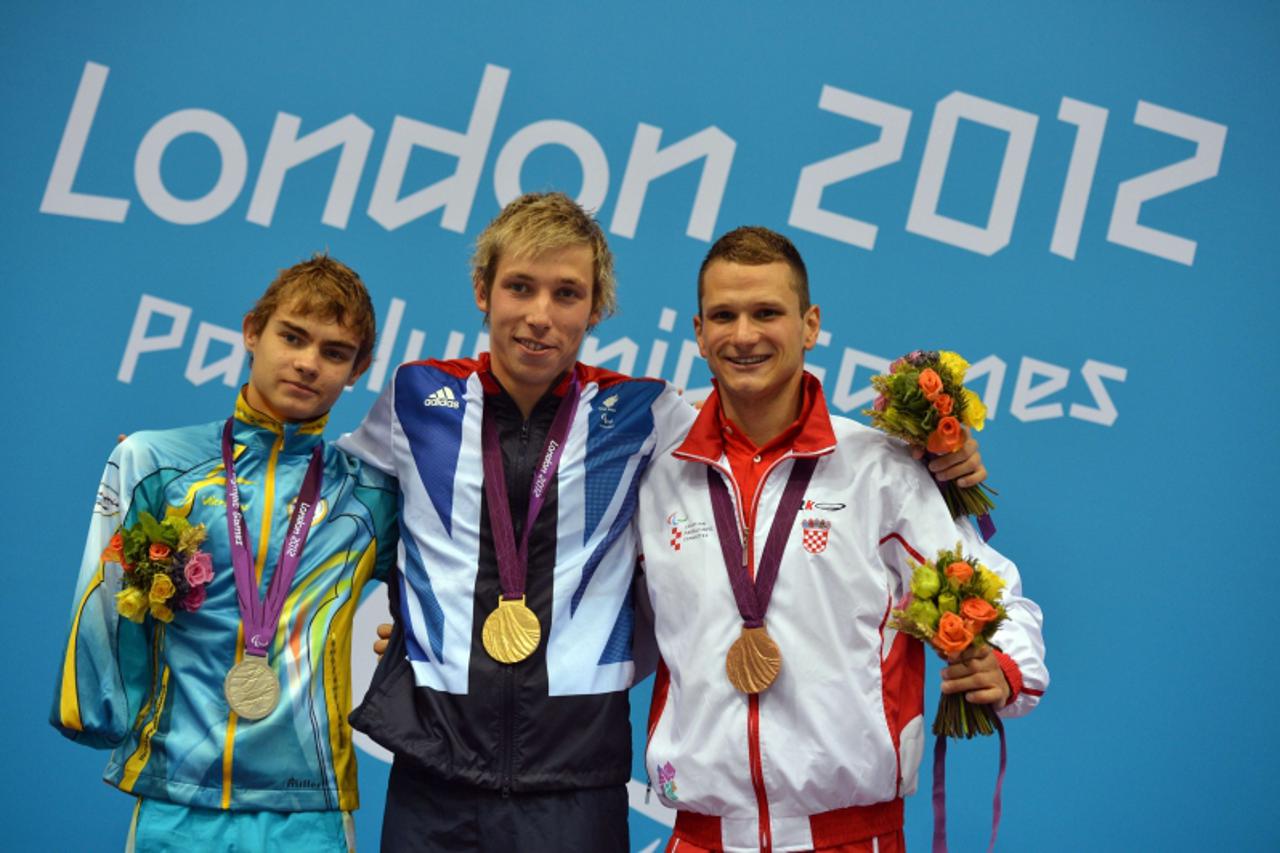 '(L-R) Ukraine's silver medallist Yevheniy Bohodayko, Britain's gold medallist Jonathan Fox and Croatia's bronze medallist Mihovil Spanja pose on the podium during the victory ceremony for the men