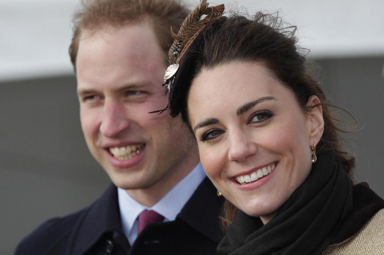 '(FILES) This file picture taken on February 24, 2011 shows Britain\'s Prince William and his fiancee Kate Middleton smiling following a naming ceremony and service of dedication for the Royal Nationa