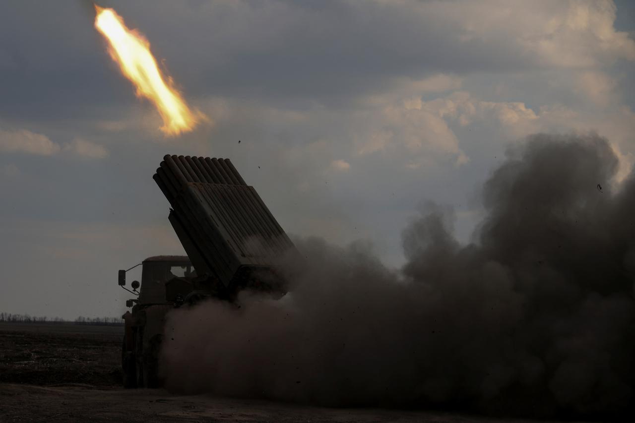 Ukrainian service members fire a Grad MLRS towards Russian troops near a front line in Donetsk region