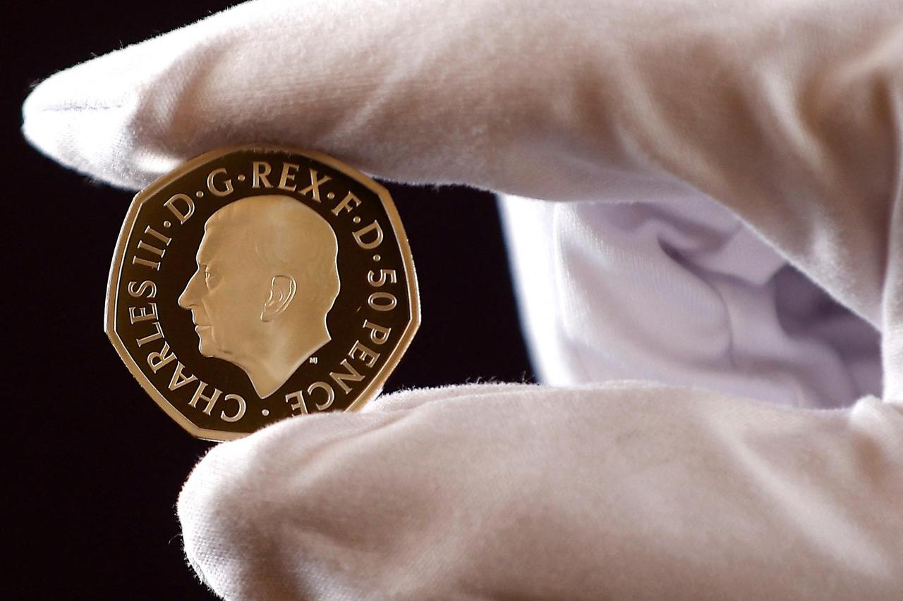 The official coin effigy of Britain’s King Charles III is seen on a 50 pence coin, unveiled by The Royal Mint, in London