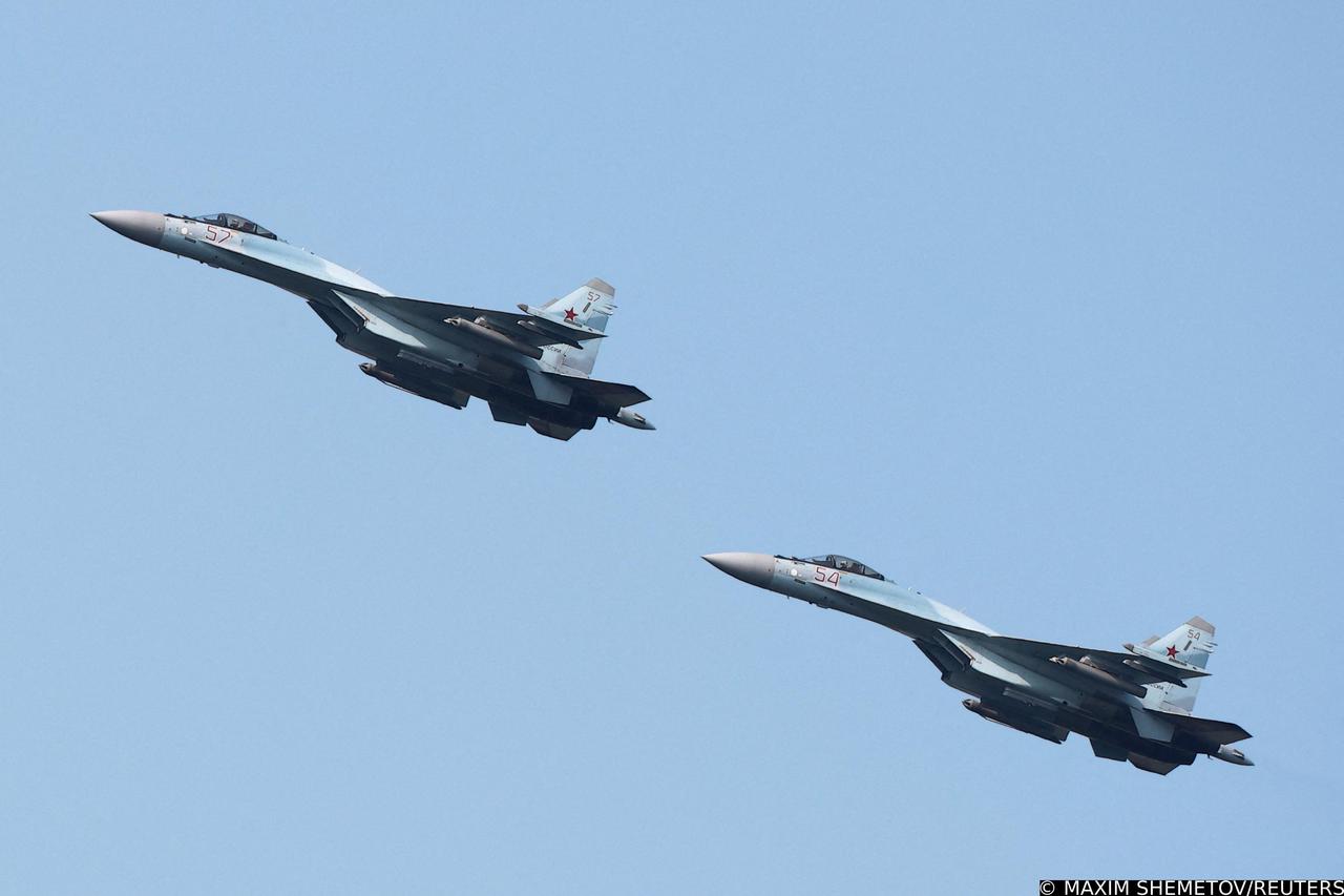 FILE PHOTO: Russian Sukhoi Su-35 jet fighters perform a flight during the Aviadarts competition outside Ryazan
