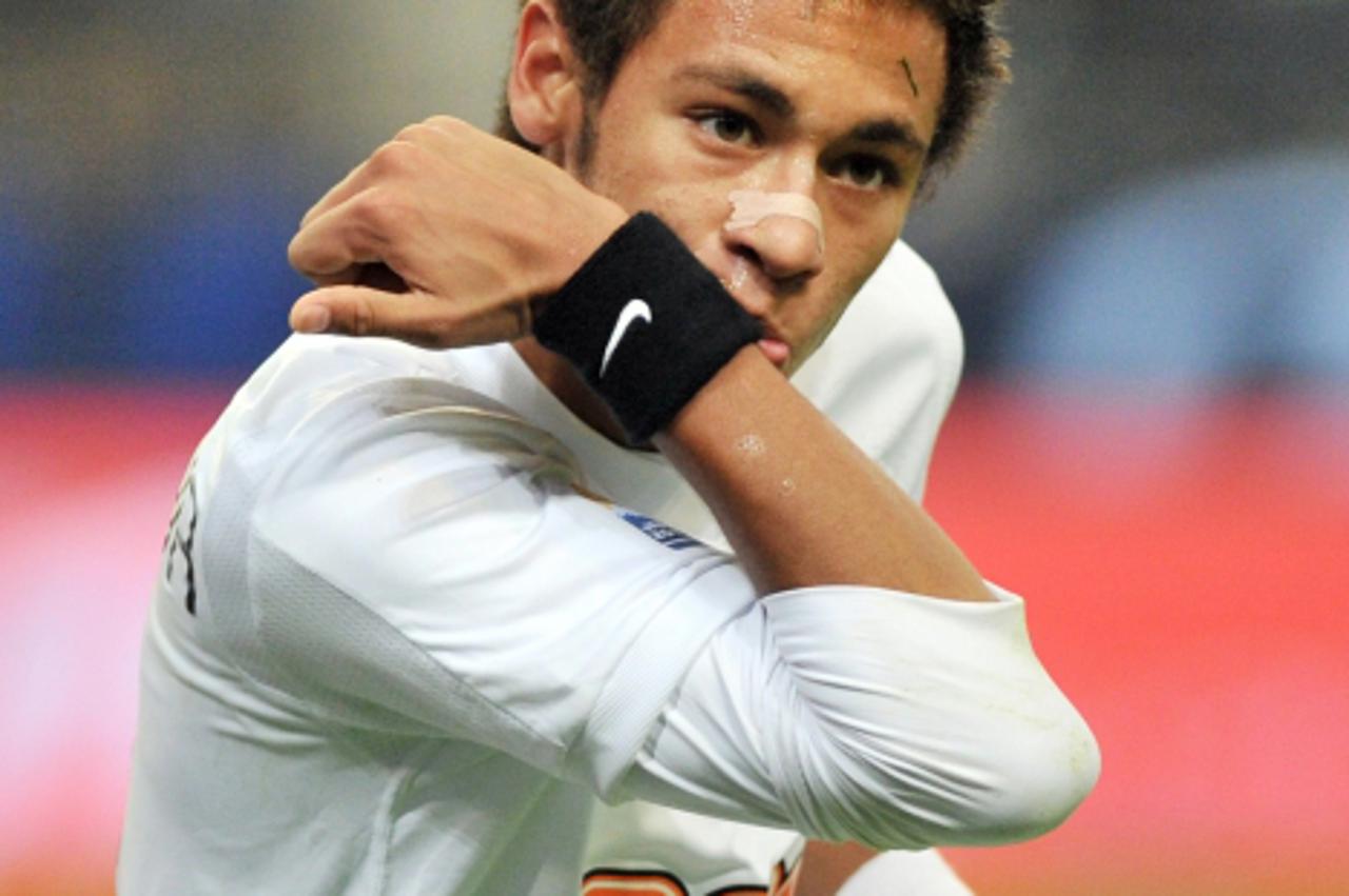 'Brazil\'s Santos striker Neymar reacts as he celebrates his goal against Japan\'s Kashiwa Reysol during their semi-final match of the Club World Cup at the Toyota Stadium in Toyota, Aichi prefecture 