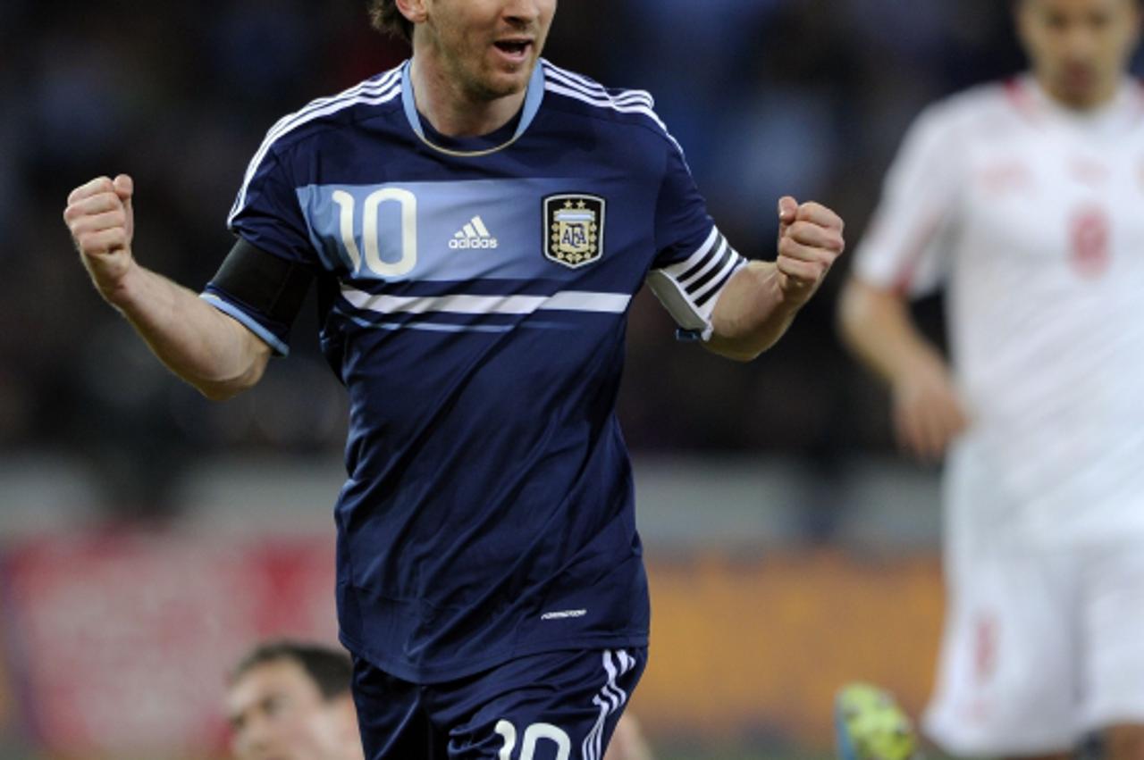 'Argerntina\'s forward Lionel Messi (L) celebrates his team\'s first goal during the international friendly football match between Switzerland and Argentina in Bern on February 29, 2012.  AFP PHOTO / 
