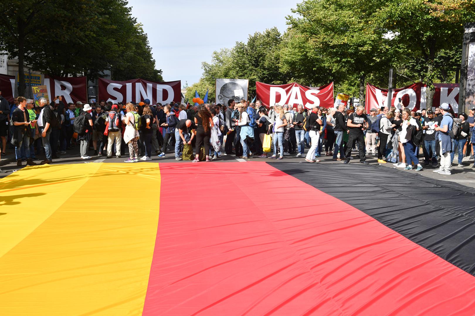 29 August 2020, Berlin: Participants gather behind a large German flag in the street for a demonstration against the Corona measures. Photo: Bernd Von Jutrczenka/dpa /DPA/PIXSELL