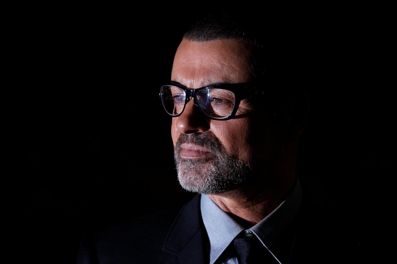 FILE PHOTO British singer George Michael poses for photographers before a news conference at the Royal Opera House in central London FILE PHOTO British singer George Michael poses for photographers before a news conference at the Royal Opera House in cent