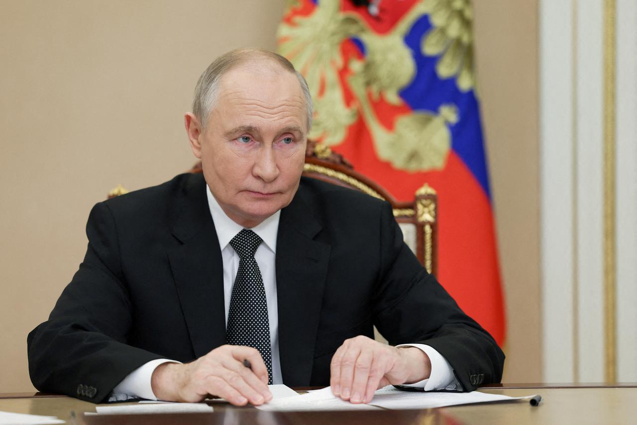 FILE PHOTO: Russian President Vladimir Putin takes part in the ceremony to launch Chukotka nuclear-powered icebreaker via video link, in Moscow