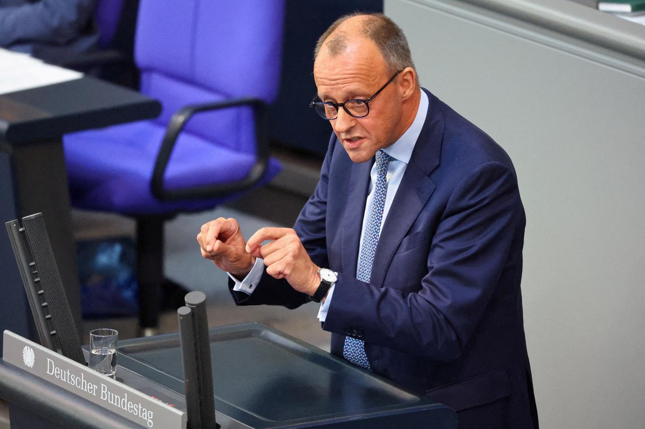 FILE PHOTO: Friedrich Merz speaks during a session of the lower house of parliament Bundestag, in Berlin