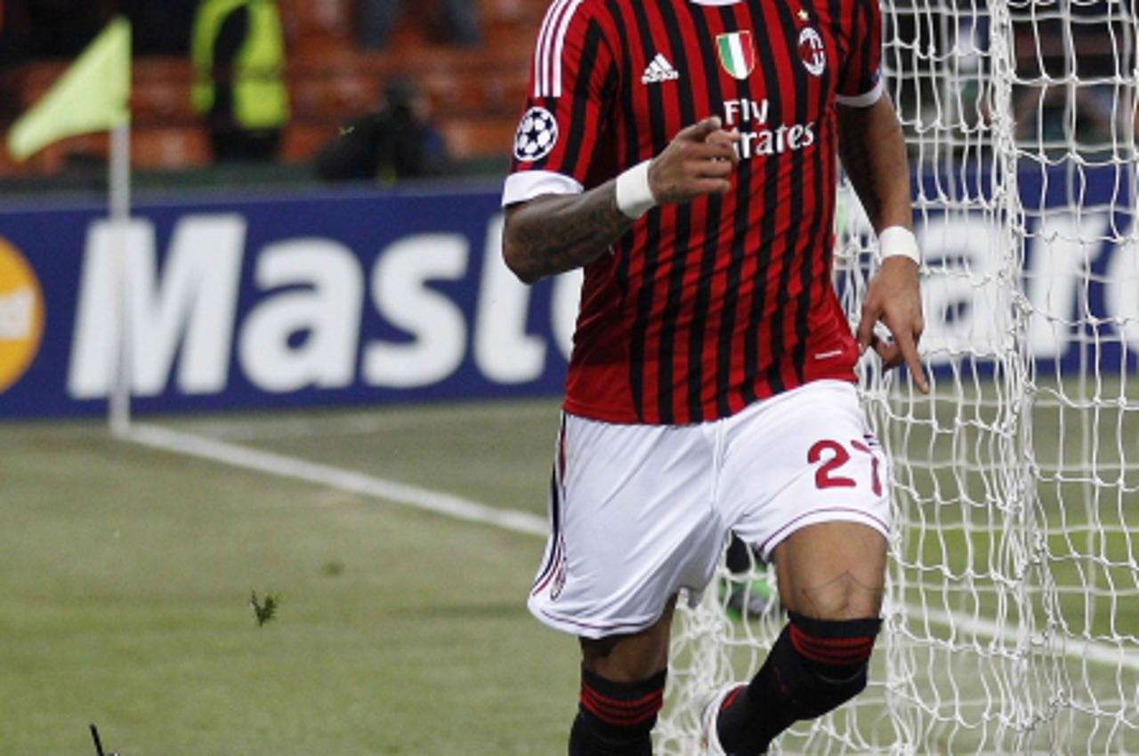 'AC Milan's Kevin Prince Boateng celebrates after scoring against Arsenal during their Champions League last 16 first leg soccer match at the San Siro Stadium in Milan February 15, 2012. REUTERS/Max 