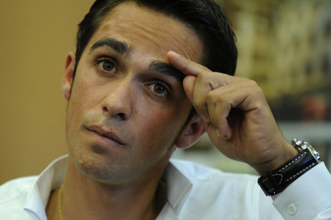 'Three-time Tour de France champion Alberto Contador gestures during a press conference on September 30, 2010 in Pinto, as he was suspended today after failing a dope test, in the latest drug scandal 