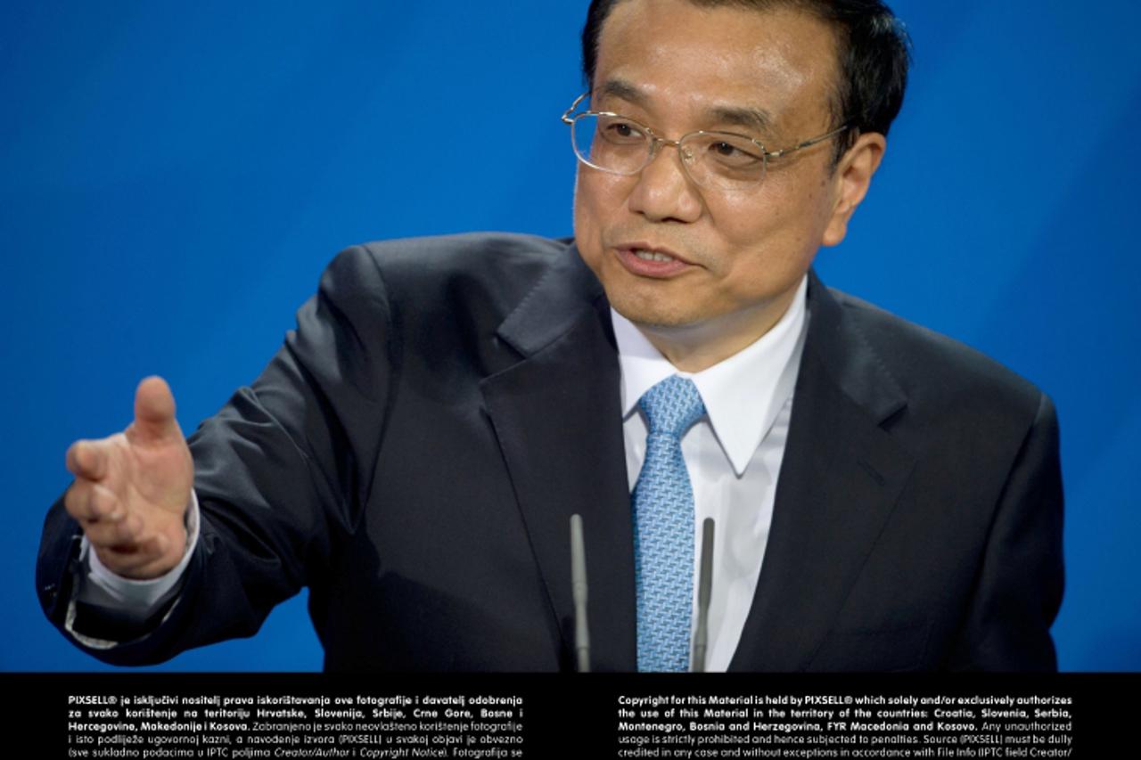 'New Premier of China Li Keqiang talks during a joint news conference with the German Chancellor at the Federal Chancellery in Berlin, Germany, 26 May 2013. The Chinese Premier is meeting with Chancel