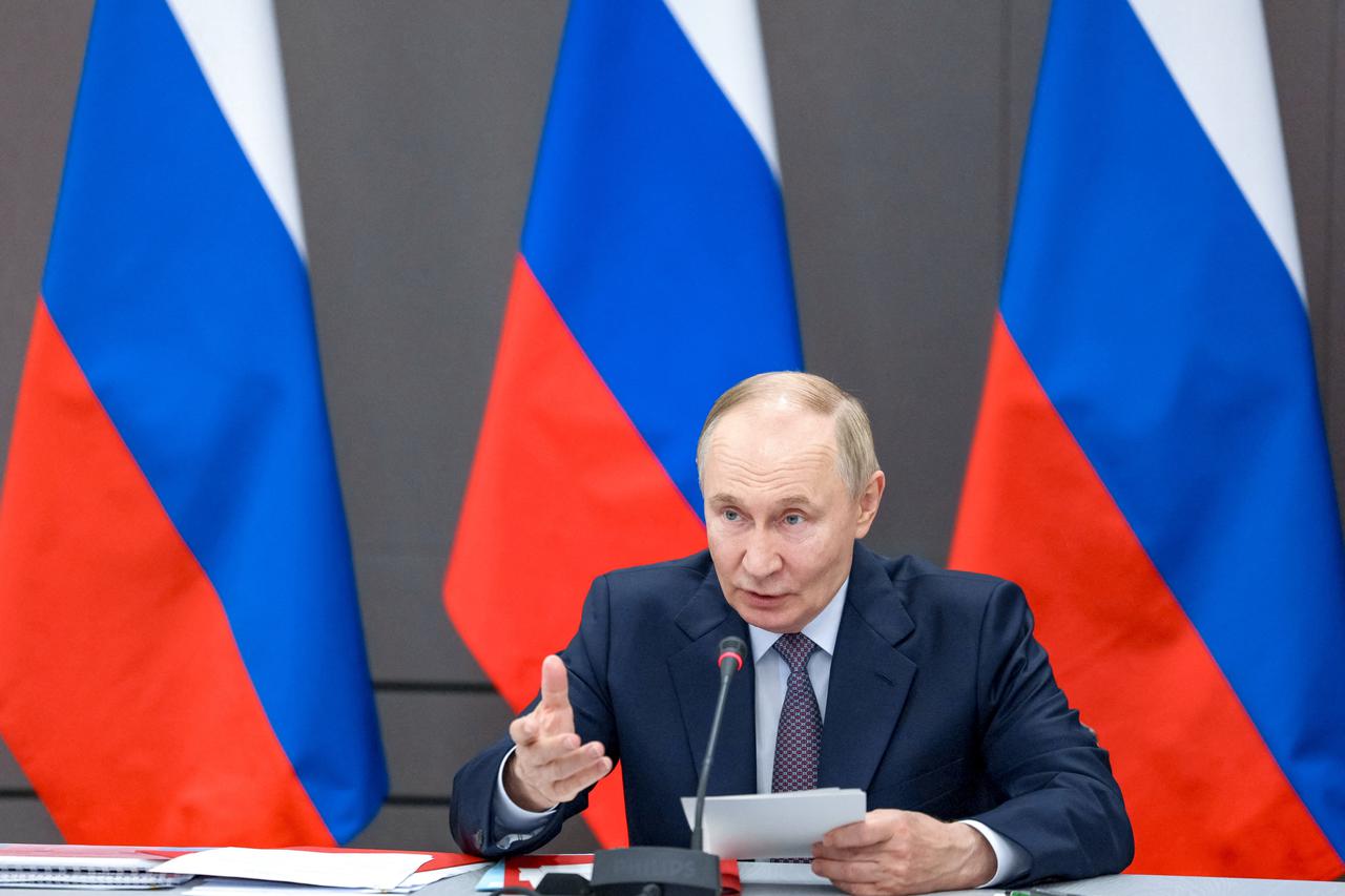 Russian President Vladimir Putin chairs a meeting of the Military-Industrial Commission in Perm