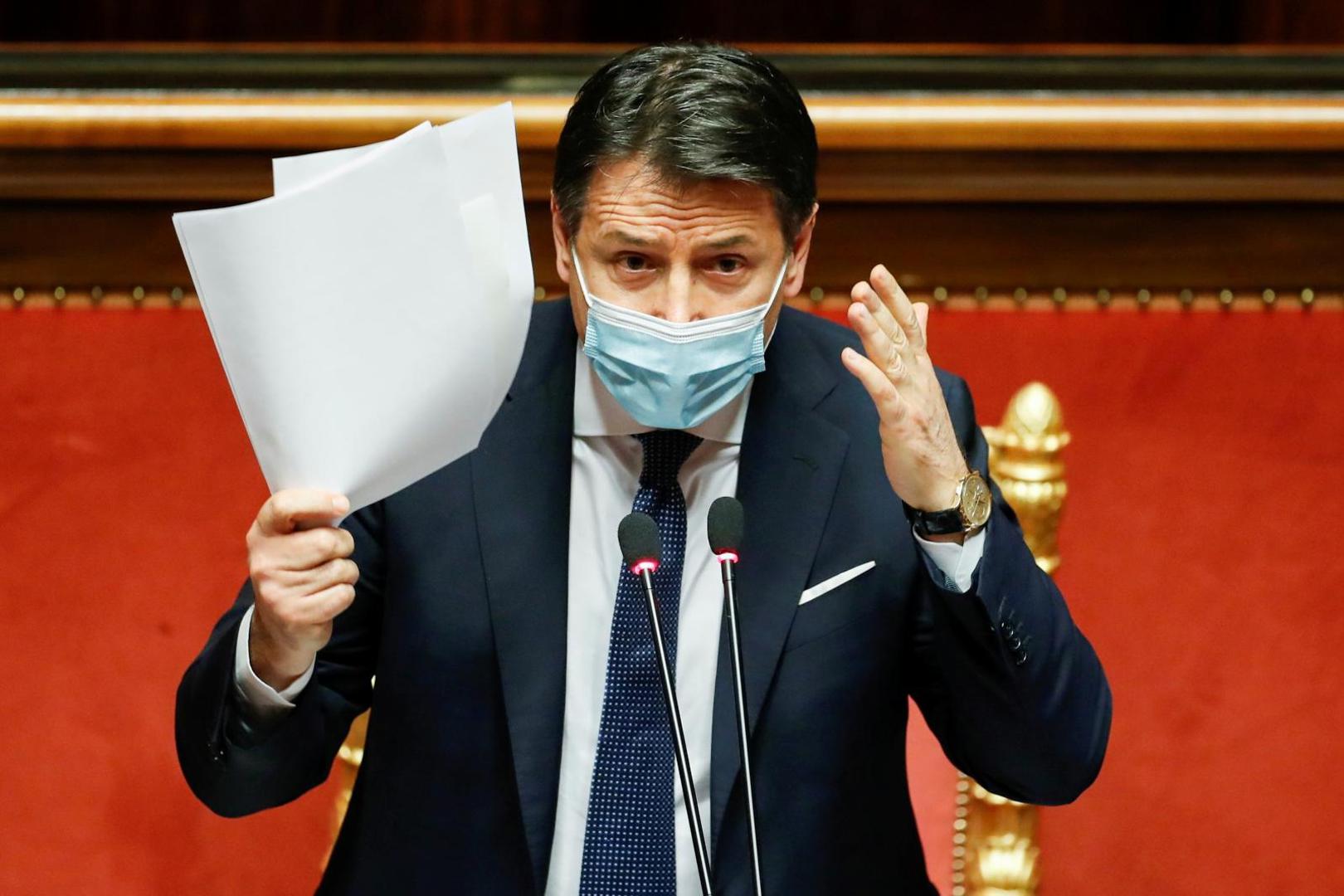 FILE PHOTO: Italian PM Conte faces a confidence vote at the upper house of parliament, in Rome FILE PHOTO: Italian Prime Minister Giuseppe Conte gestures as he speaks ahead of a confidence vote at the upper house of parliament after former Prime Minister Matteo Renzi pulled his party out of government, in Rome, Italy, January 19, 2021. REUTERS/Yara Nardi/Pool/File Photo YARA NARDI
