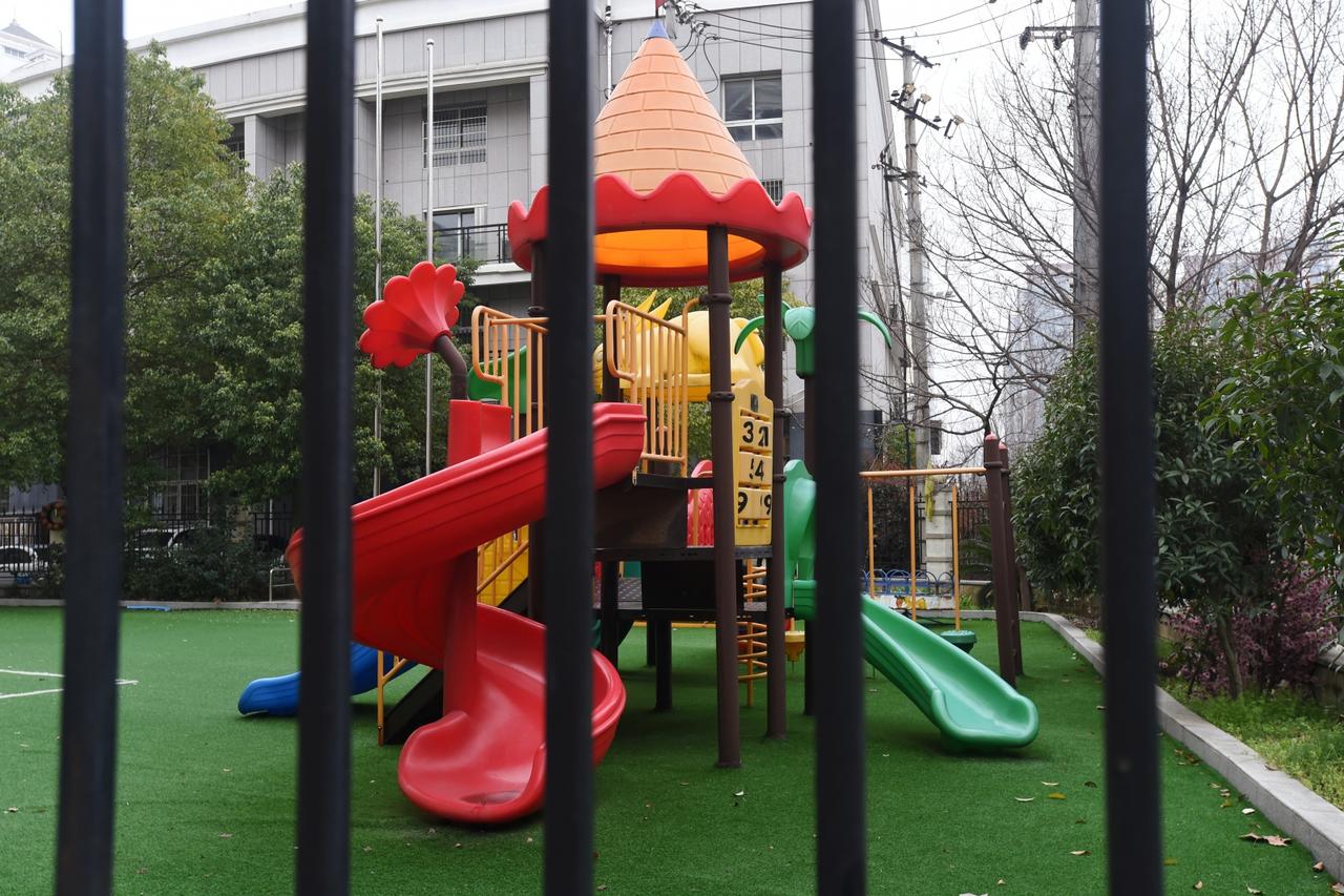 Playground is seen through the fence of a closed kindergarten in Wuhan, the epicentre of the novel coronavirus outbreak