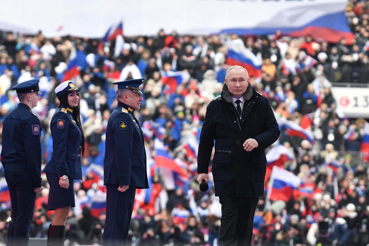 Russian President Putin attends a concert on the eve of the Defender of Fatherland Day in Moscow