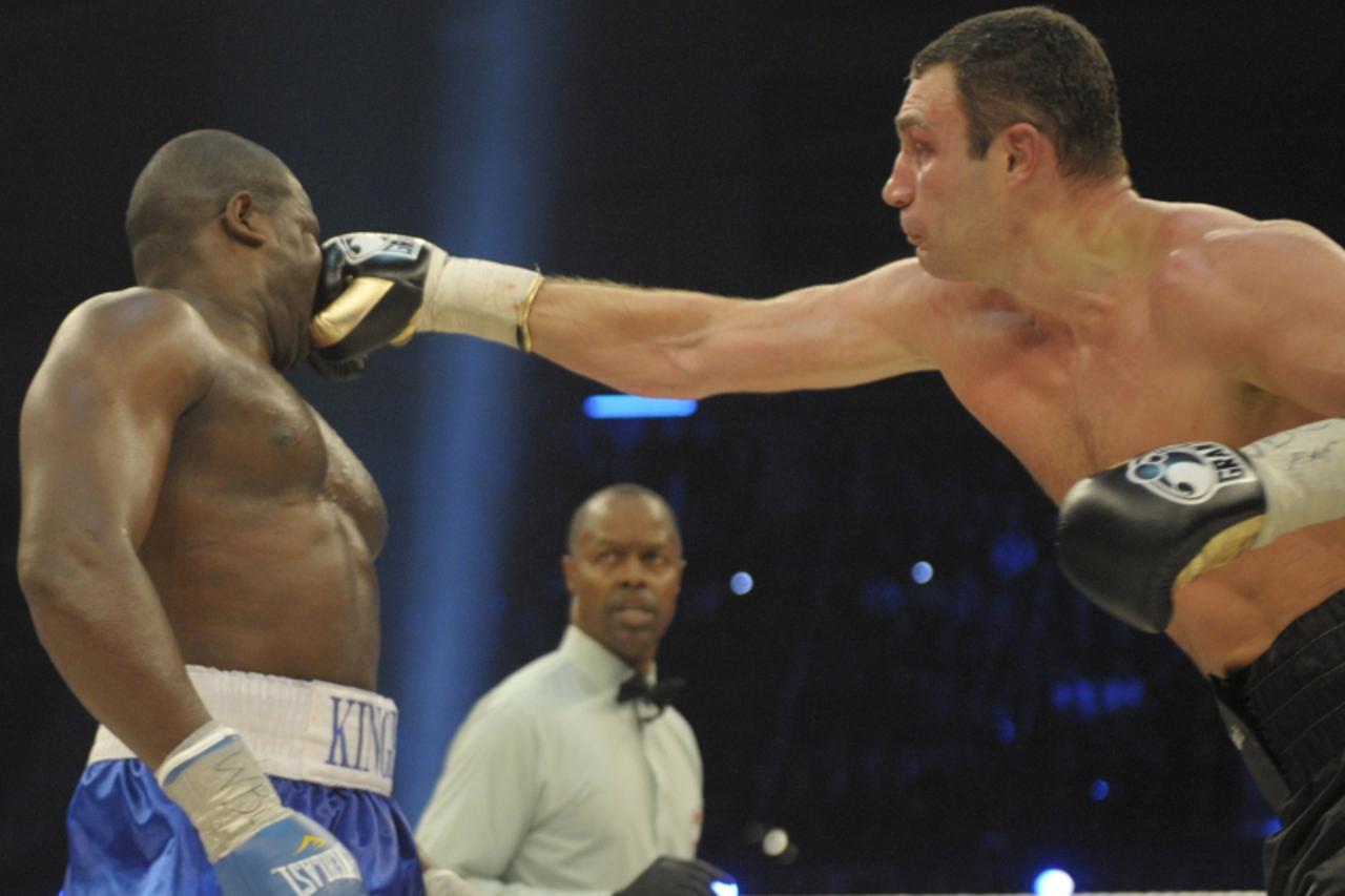 'Ukrainian heavyweight world champion Vitali Klitschko (R) and challenger Kevin Johnson from the US box during the WBC Heavyweight World Championship boxing bout in Bern, Switzerland on December 12, 2