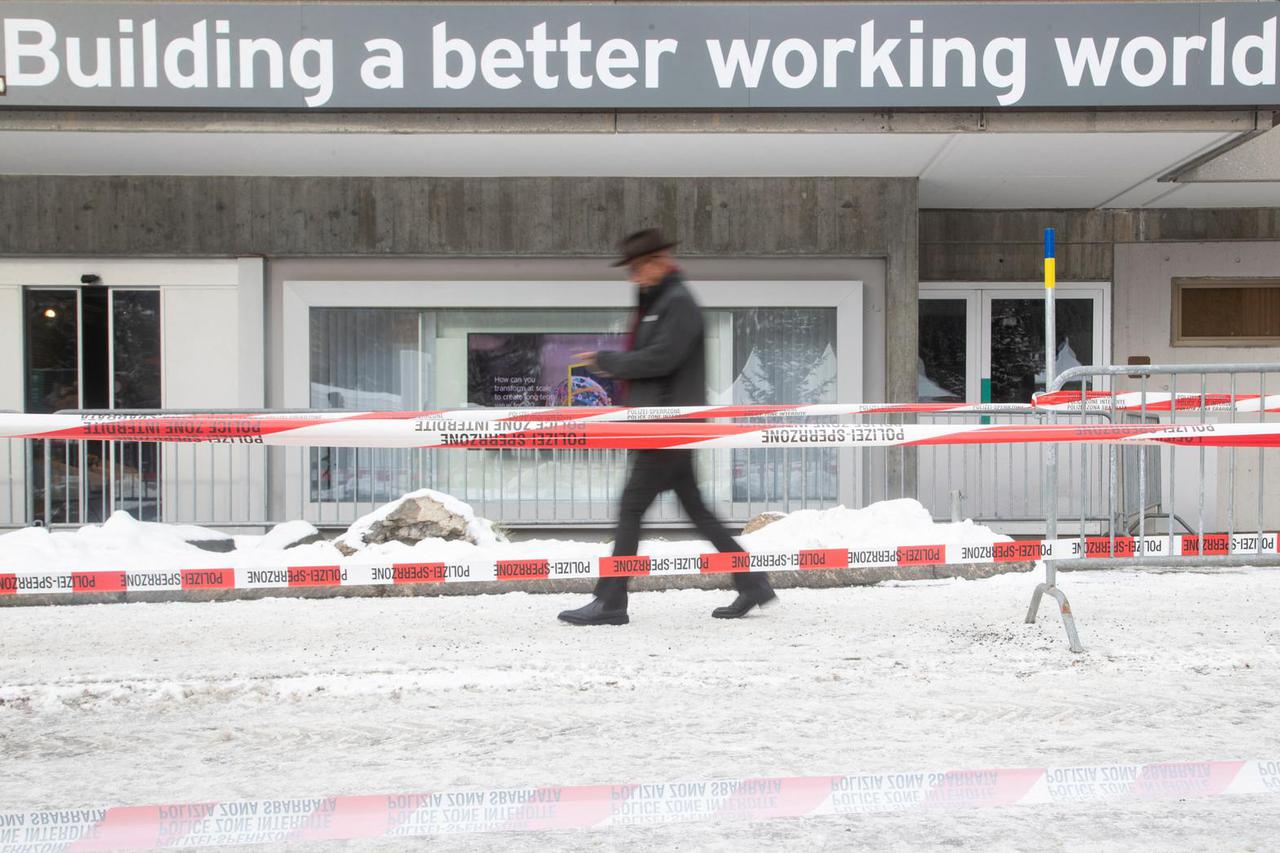 A man walks on the Promenade road during the World Economic Forum in Davos