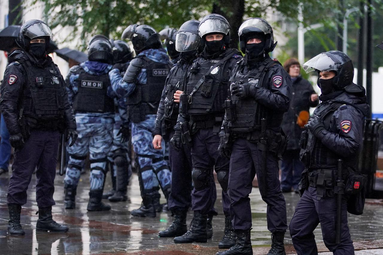 FILE PHOTO: Russian police officers stand guard during a rally in Moscow