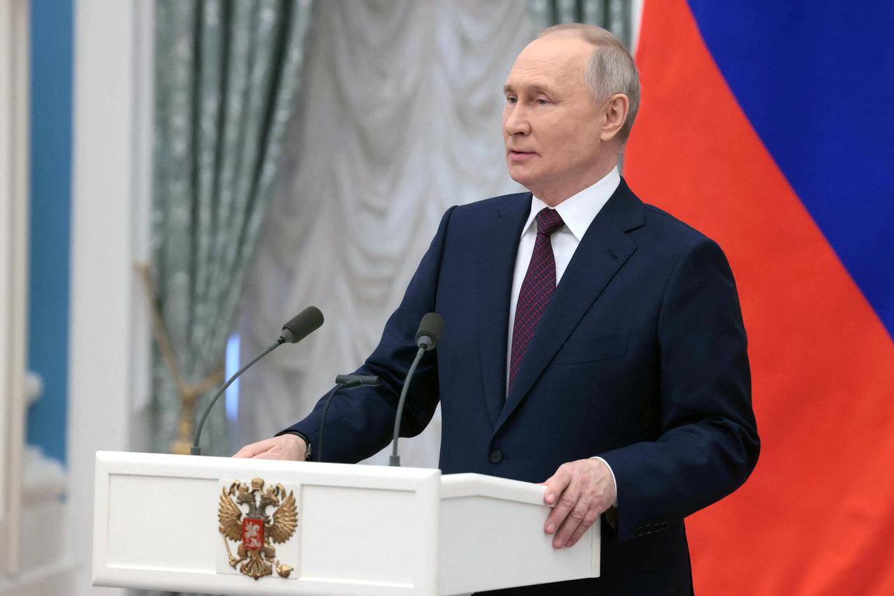 Russian President Putin attends a ceremony marking International Women's Day