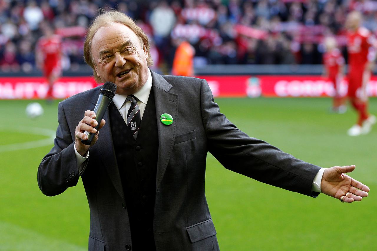 FILE PHOTO: Liverpool supporter and singer Marsden sings before their English Premier League soccer match against Blackburn Rovers at Anfield in Liverpool