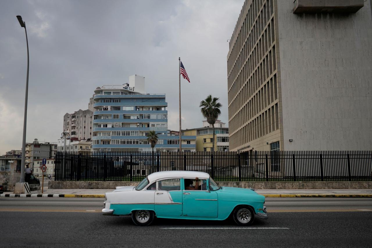 FILE PHOTO: A vintage car passes by the U.S. Embassy in Havana