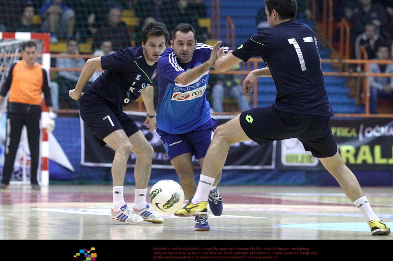 '26.12.2012., Zagreb - Tradicionalni 42. malonogometni turnir Kutija Sibica 2012., cetvrtina finala, GPV Elkro Gospic - PromotionPlay, 0-2. Kosta Djukic, Marko Korecic, Hrvoje Strok.  Photo: Goran Sta
