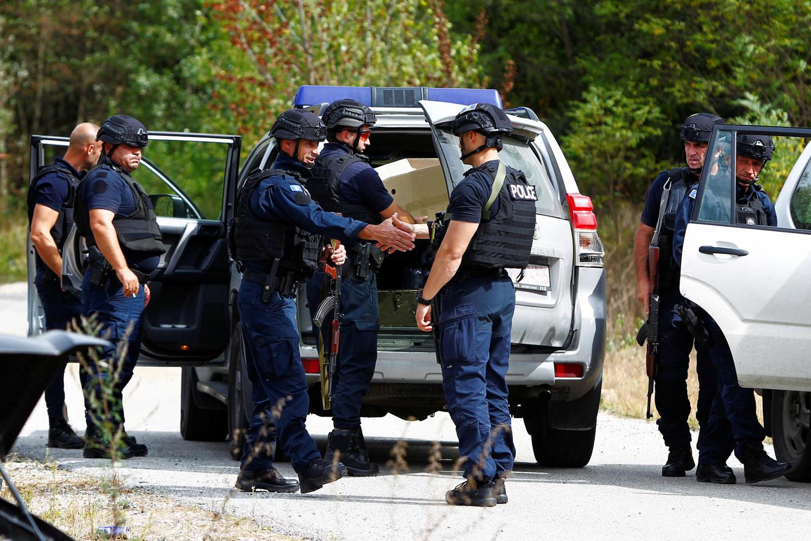 Police officers keep guard in the aftermath of a shooting, near the village of Zvecane, Kosovo September 24, 2023. REUTERS/Ognen Teofilovski Photo: OGNEN TEOFILOVSKI/REUTERS