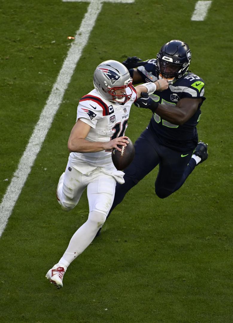 New England Patriots quarterback Drake Maye (10) is chased by Seattle Seahawks linebacker Boye Mafe (53) during the NFL Super Bowl 60 LX football game between the New England Patriots and the Seattle Seahawks in Santa Clara, CA on Feb 8, 2026 Charles Baus/CSM.(Credit Image:  Charles Baus/Cal Sport Media) Photo via Newscom Photo: Charles Baus/NEWSCOM