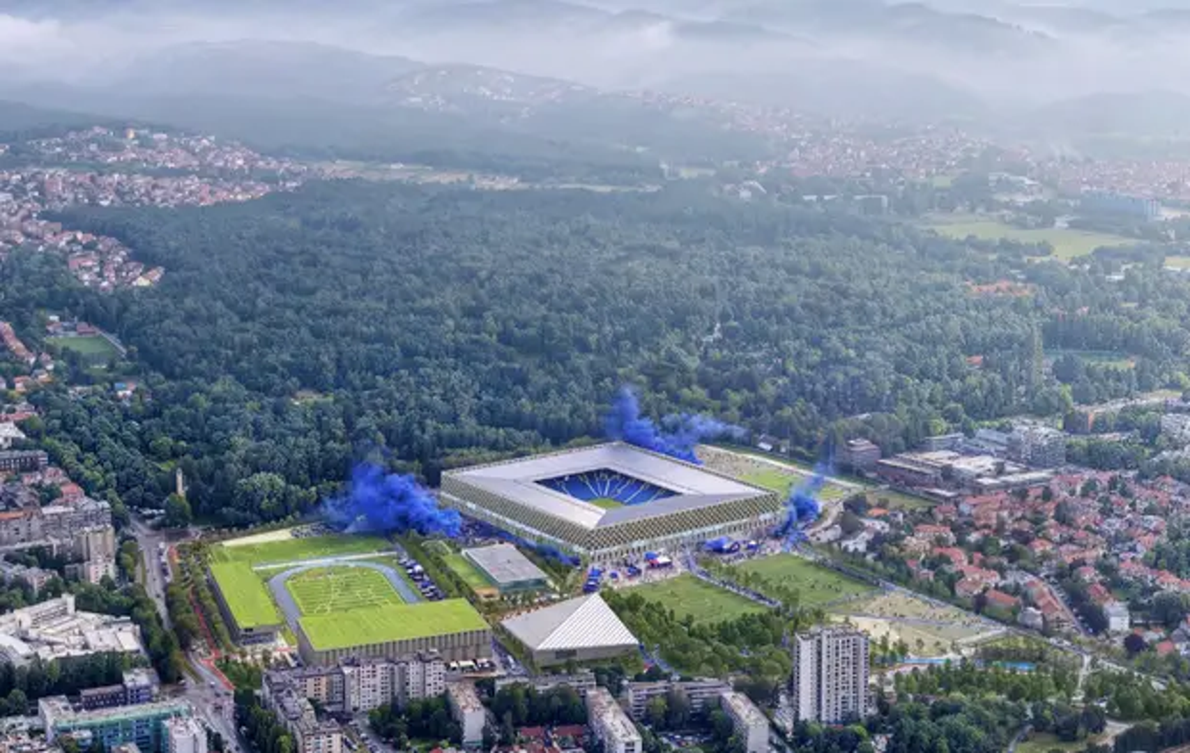 „Plava tvrđava” prevodi identitet kluba u kompaktan, gotovo kvadratičan volumen stadiona, obavijen ritmom plavo-sivih polja i zatvoren prema van poput čvrstog urbanog bloka. Krov se spušta prema središnjem otvoru iznad igrališta, dok se unutrašnjost snažno odvaja od mirne vanjske pojavnosti kroz boju, navijačke rituale i kontinuiranu tribinsku zdjelu.